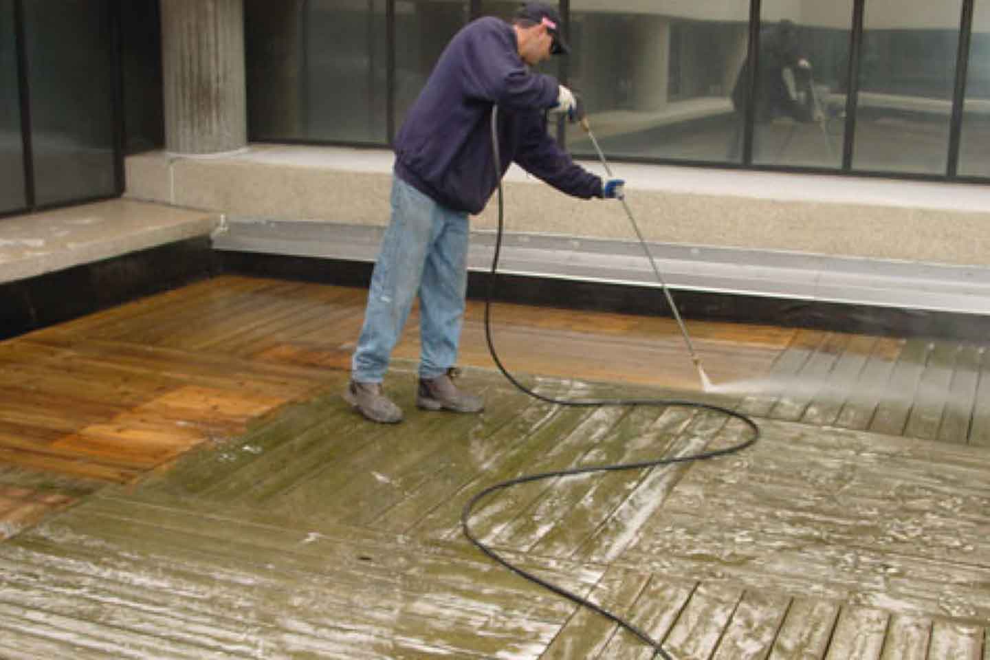 Power Washing Wood Rooftop Deck